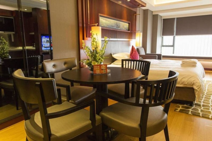 Imagen de la habitación del Hotel Guangzhou Yiyuan Apartment. Foto 12