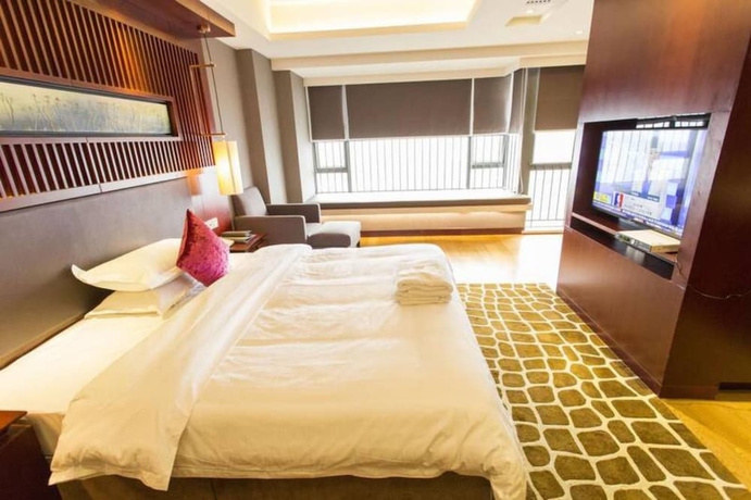 Imagen de la habitación del Hotel Guangzhou Yiyuan Apartment. Foto 13