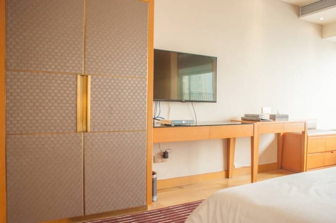Imagen de la habitación del Hotel Guangzhou Yiyuan Apartment. Foto 14
