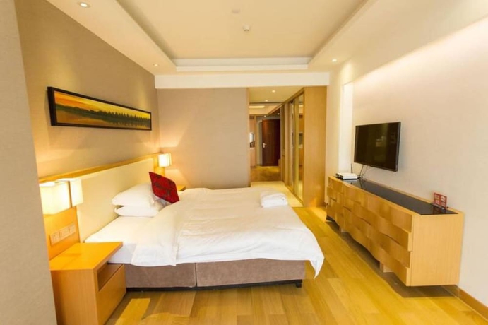 Imagen de la habitación del Hotel Guangzhou Yiyuan Apartment. Foto 15