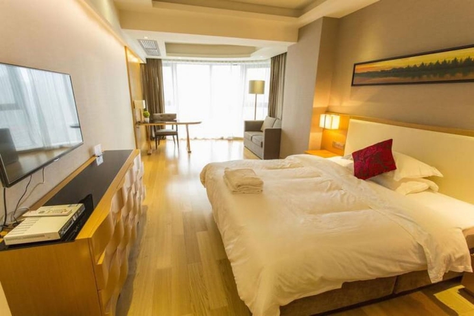 Imagen de la habitación del Hotel Guangzhou Yiyuan Apartment. Foto 16