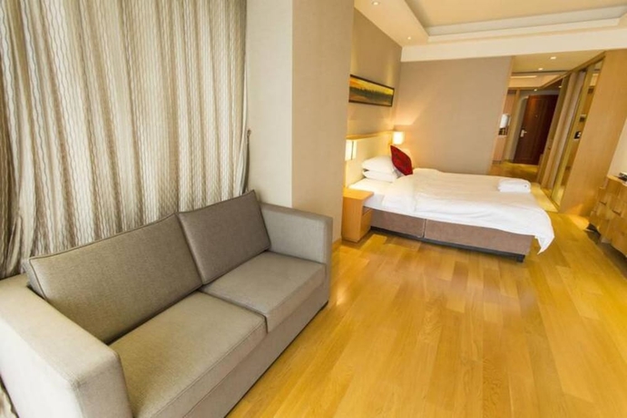 Imagen de la habitación del Hotel Guangzhou Yiyuan Apartment. Foto 19