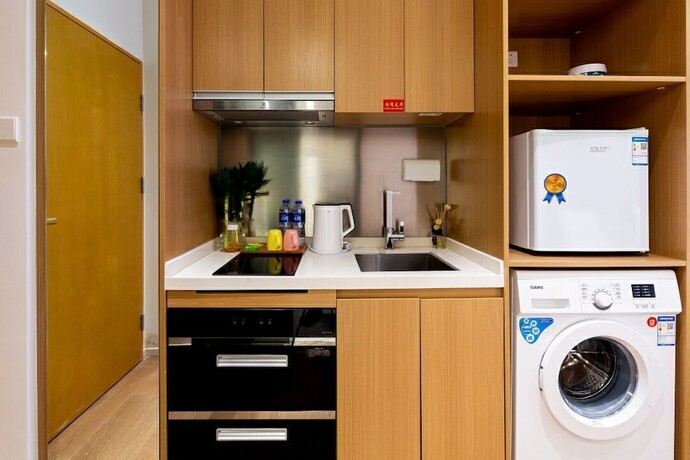 Imagen de la habitación del Hotel Guangzhou Yu Apartment. Foto 19