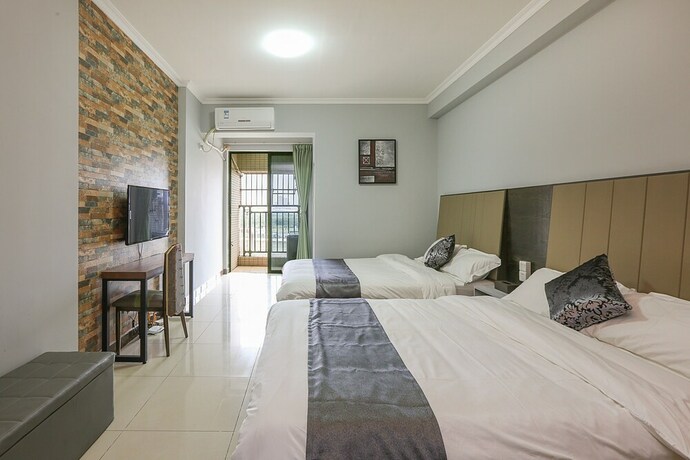 Imagen de la habitación del Hotel Guangzhou Yuting Apartment. Foto 23