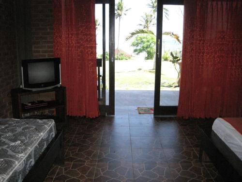 Imagen de la habitación del Hotel Gubug Balian Beach Bungalow. Foto 6