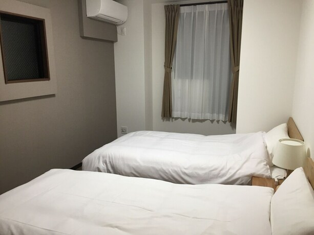 Imagen de la habitación del Hotel Guest House Koiyamacho. Foto 21