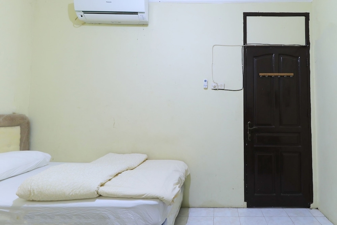 Imagen de la habitación del Hotel Guest House Samarinda. Foto 11
