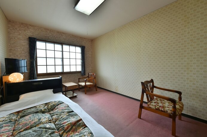 Imagen de la habitación del Hotel Guest House Takenoya. Foto 11