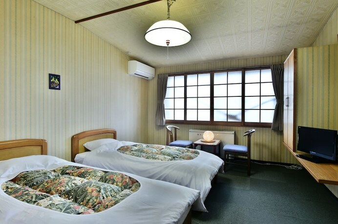 Imagen de la habitación del Hotel Guest House Takenoya. Foto 12