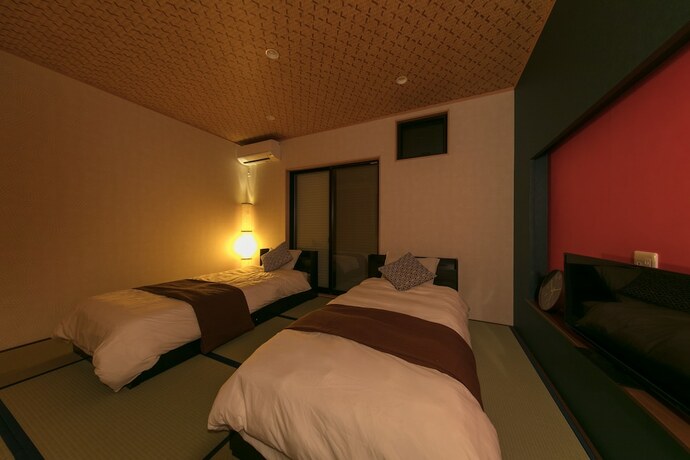 Imagen de la habitación del Hotel Guesthouse Higasikujyou Yanagi Sitamachi. Foto 17