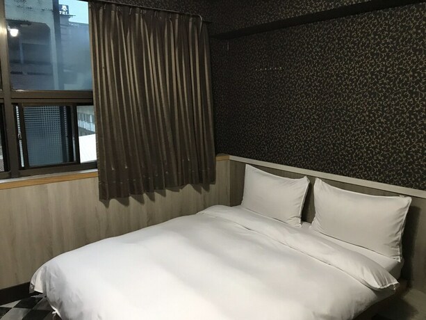 Imagen de la habitación del Hotel Gui Zu. Foto 32