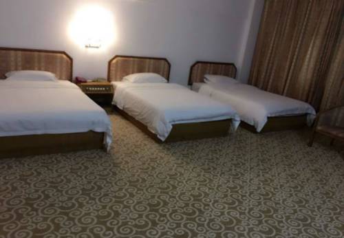 Imagen de la habitación del Hotel Guibin Lou. Foto 2