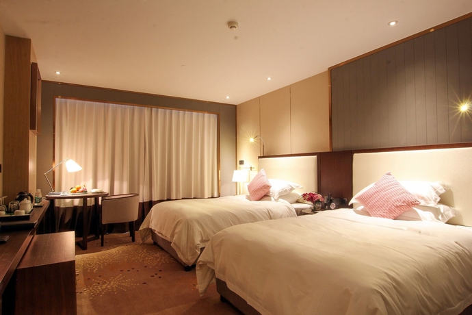 Imagen de la habitación del Hotel Guilin Exhibition International Boutique. Foto 12