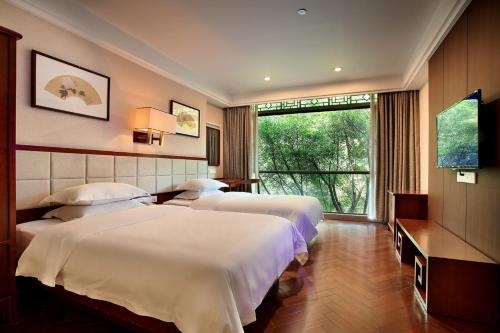 Imagen de la habitación del Hotel Guilin Zizhou Panorama Resort. Foto 7
