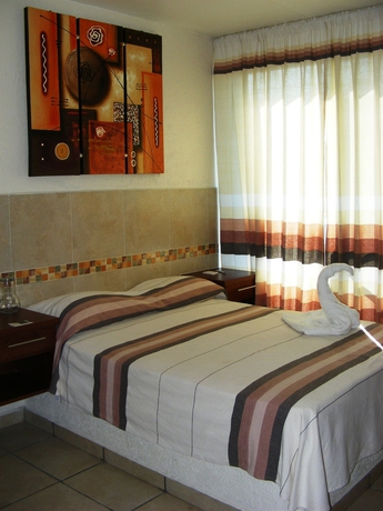 Imagen de la habitación del Hotel Guiv&aacute; Huatulco. Foto 2