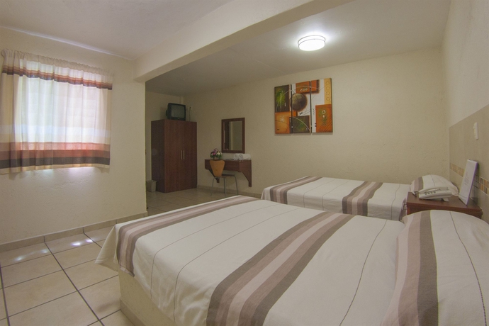 Imagen de la habitación del Hotel Guiv&aacute; Huatulco. Foto 4