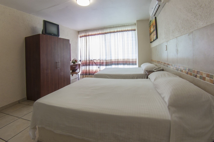Imagen de la habitación del Hotel Guiv&aacute; Huatulco. Foto 6
