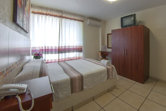 Imagen de la habitación del Hotel Guiv&aacute; Huatulco. Foto 7