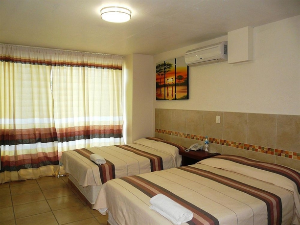 Imagen de la habitación del Hotel Guiv&aacute; Huatulco. Foto 8