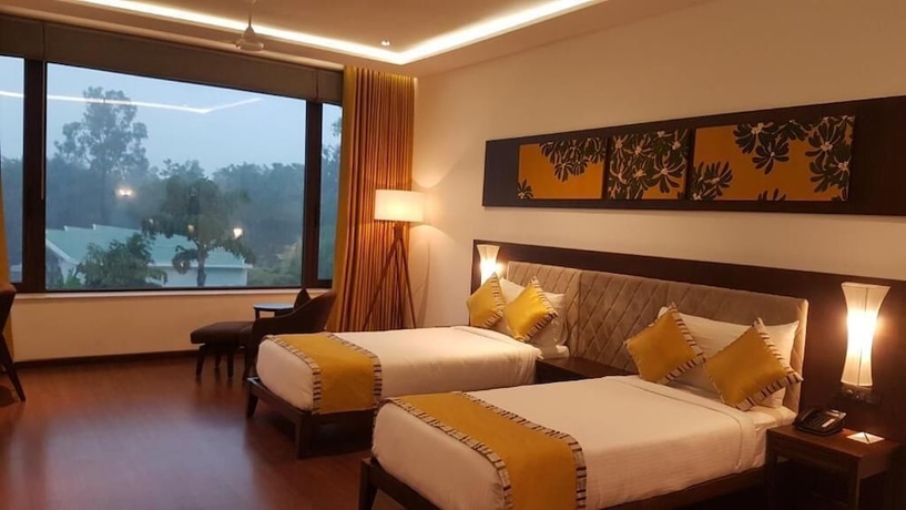 Imagen de la habitación del Hotel Gulmohar Greens - Golf and Country Club. Foto 17