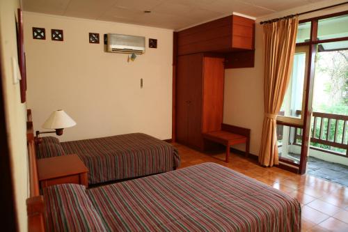 Imagen de la habitación del Hotel Gunung Geulis Cottages managed by Royal Tulip. Foto 6