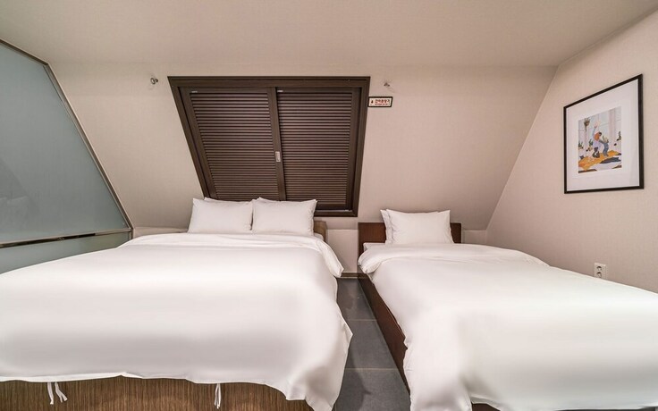 Imagen de la habitación del Hotel Guri Boutique Yeogi. Foto 15