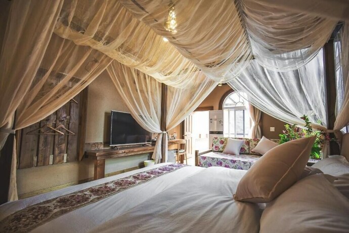 Imagen de la habitación del Hotel Guyue Caotang Inn. Foto 17