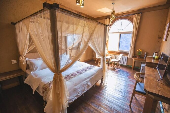 Imagen de la habitación del Hotel Guyue Caotang Inn. Foto 18