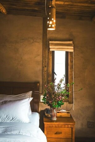 Imagen de la habitación del Hotel Guyue Caotang Inn. Foto 19