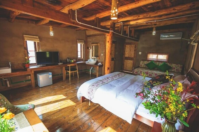 Imagen de la habitación del Hotel Guyue Caotang Inn. Foto 21