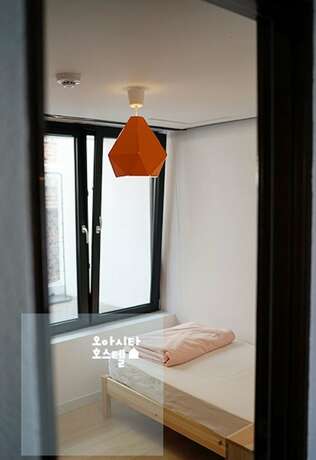 Imagen de la habitación del Hotel Gwangju Oasita Hostel. Foto 12