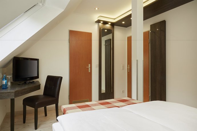 Imagen de la habitación del Hotel H+ Hotel Nurnberg. Foto 10