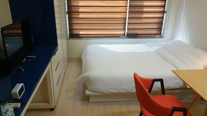 Imagen de la habitación del Hotel H Stay. Foto 10