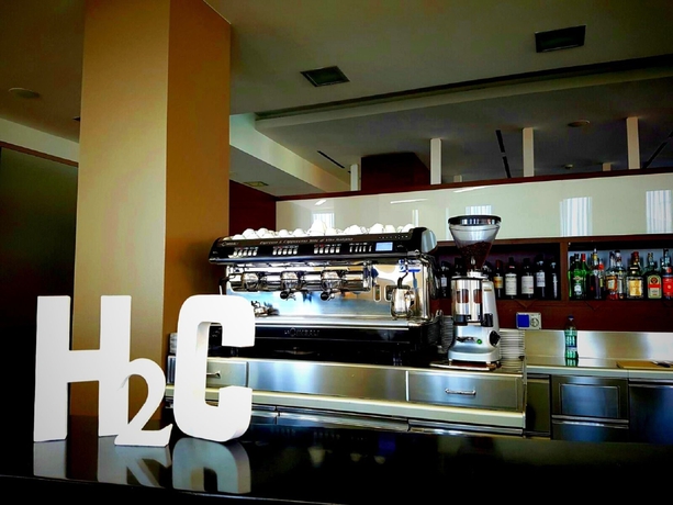 Imagen del bar/restaurante del Hotel H2c Milanofiori. Foto 2