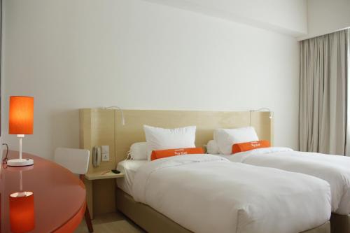 Imagen de la habitación del Hotel HARRIS Hotel Pontianak. Foto 6
