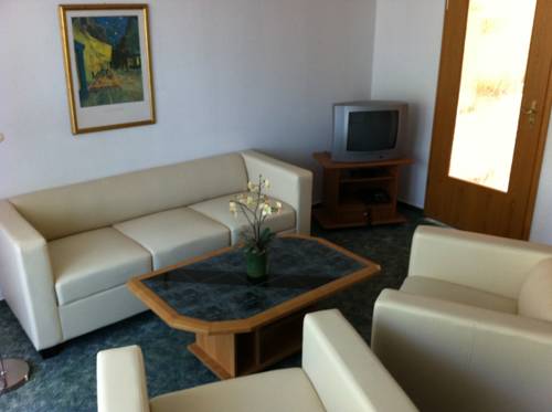Imagen de la habitación del Hotel HAUS USEDOM Ferienwohnanlage mit Fr&uuml;hst&uuml;cks-Restaurant gegen&uuml;ber im Seeschl&ouml;sschen. Foto 5