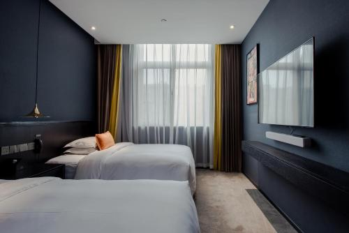Imagen de la habitación del Hotel HE DESIGNER HOTEL Xi\'an Drum Tower & YONGNING Gate Branch. Foto 9