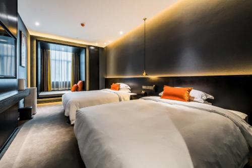 Imagen de la habitación del Hotel HE DESIGNER HOTEL Xi\'an Drum Tower & YONGNING Gate Branch. Foto 10