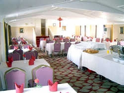 Imagen del bar/restaurante del Hotel HEJING BUSINESS. Foto 2