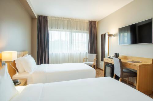Imagen de la habitación del Hotel HF Tuela Porto. Foto 16