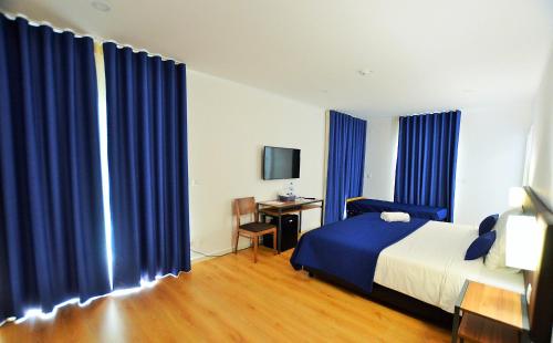 Imagen de la habitación del Hotel HILLTOP OASIS Lisbon Lux Oeiras. Foto 7