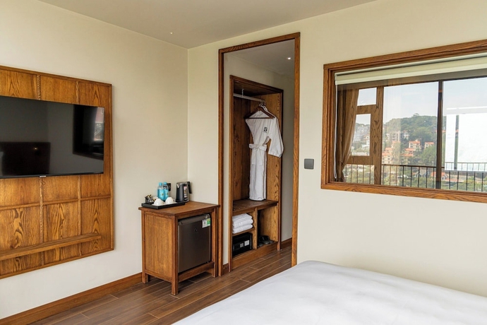 Imagen de la habitación del Hotel HLS Dalat Lodge. Foto 10