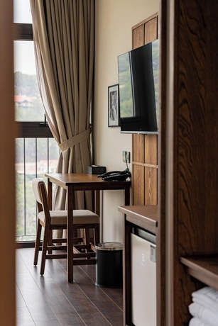 Imagen de la habitación del Hotel HLS Dalat Lodge. Foto 14