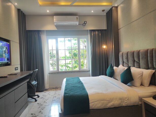 Imagen de la habitación del Hotel HM Resort, Dibrugarh. Foto 2