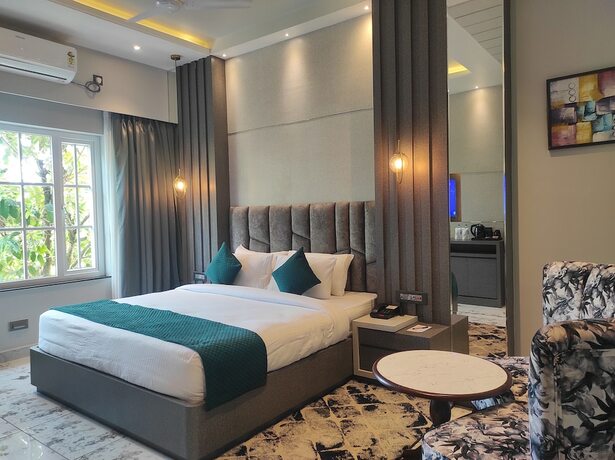 Imagen de la habitación del Hotel HM Resort, Dibrugarh. Foto 3