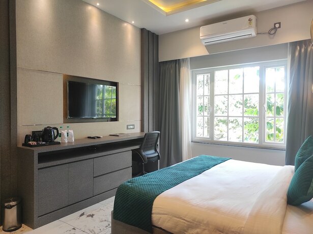 Imagen de la habitación del Hotel HM Resort, Dibrugarh. Foto 4