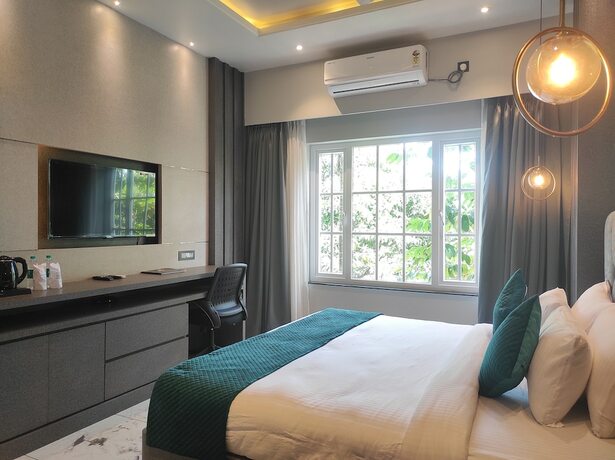 Imagen de la habitación del Hotel HM Resort, Dibrugarh. Foto 9