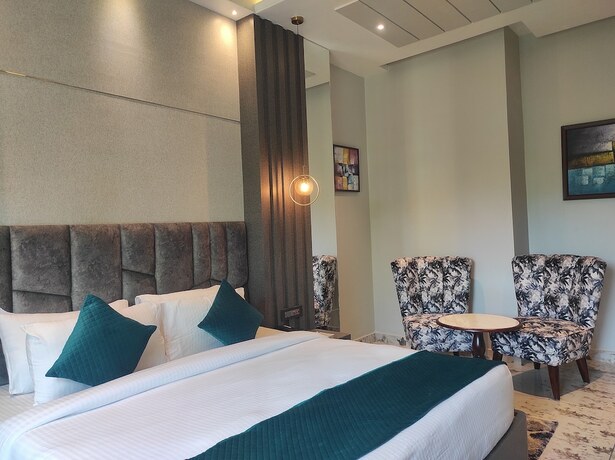Imagen de la habitación del Hotel HM Resort, Dibrugarh. Foto 10