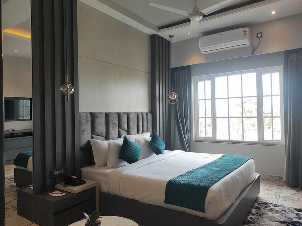 Imagen de la habitación del Hotel HM Resort, Dibrugarh. Foto 11
