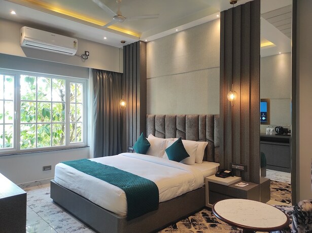 Imagen de la habitación del Hotel HM Resort, Dibrugarh. Foto 12